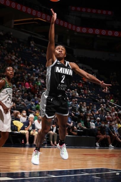 Crystal Dangerfield of the Minnesota Lynx drives to the basket during the game against the Seattle Storm on August 24, 2021 at Target Center in...