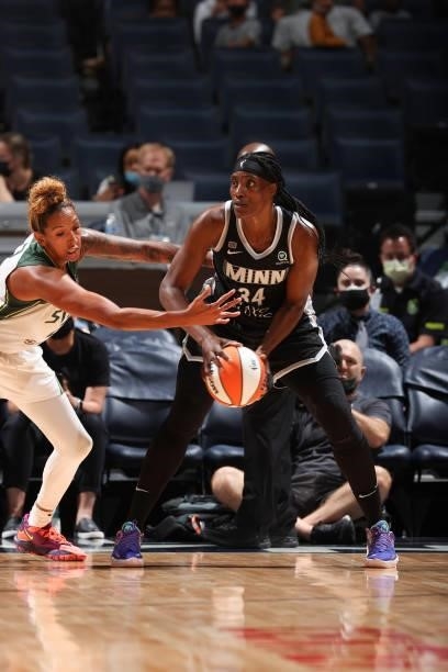 Sylvia Fowles of the Minnesota Lynx looks to pass the ball during the game against the Seattle Storm on August 24, 2021 at Target Center in...