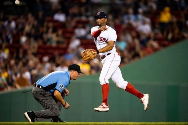 Xander Bogaerts of the Boston Red Sox throws during the second inning of a game against the Minnesota Twins on August 24, 2021 at Fenway Park in...