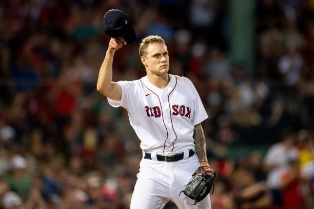 Tanner Houck of the Boston Red Sox reacts during the third inning of a game against the Minnesota Twins on August 24, 2021 at Fenway Park in Boston,...