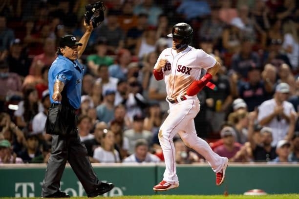 Enrique Hernandez of the Boston Red Sox scores during the fifth inning of a game against the Minnesota Twins on August 24, 2021 at Fenway Park in...