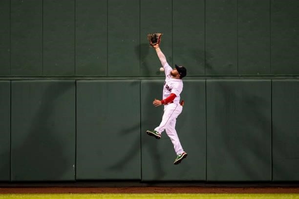 Alex Verdugo of the Boston Red Sox attempts to catch a fly ball during the fourth inning of a game against the Minnesota Twins on August 24, 2021 at...
