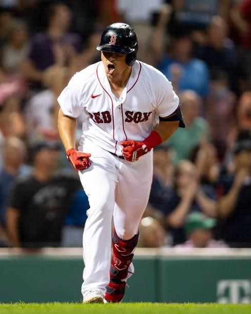 Hunter Renfroe of the Boston Red Sox reacts after hitting a two-run home run during the fifth inning of a game against the Minnesota Twins on August...