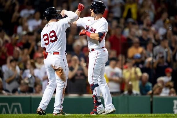 Hunter Renfroe of the Boston Red Sox reacts with Alex Verdugo after hitting a two-run home run during the fifth inning of a game against the...