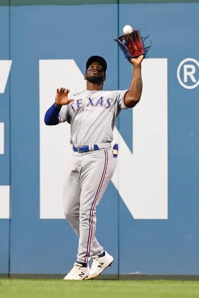 Adolis García of the Texas Rangers catches a fly ball off the bat of Amed Rosario of the Cleveland Indians in the eighth inning at Progressive Field...