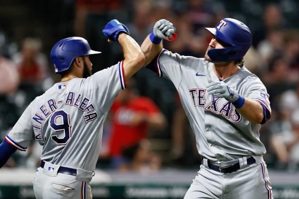 Peters of the Texas Rangers celebrates his three-run home run off of Bryan Shaw of the Cleveland Indians with Isiah Kiner-Falefa in the ninth inning...