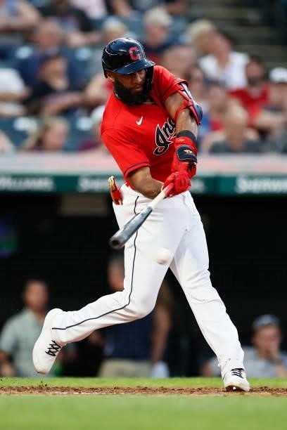 Amed Rosario of the Cleveland Indians hits a single off of Taylor Hearn of the Texas Rangers in the third inning at Progressive Field on August 24,...