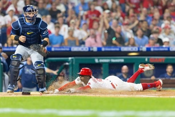 Didi Gregorius of the Philadelphia Phillies slides home safely in the bottom of the fourth inning against Mike Zunino of the Tampa Bay Rays at...