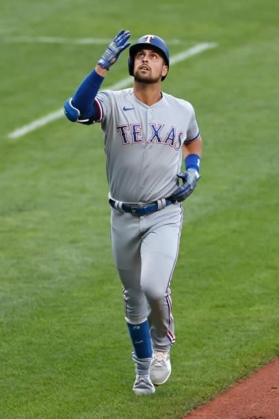 Nathaniel Lowe of the Texas Rangers rounds the bases on his three-run home run off of Eli Morgan of the Cleveland Indians in the first inning at...