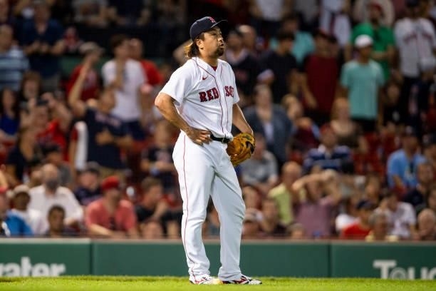 Hirokazu Sawamura of the Boston Red Sox reacts after allowing a run during the seventh inning of a game against the Minnesota Twins on August 24,...