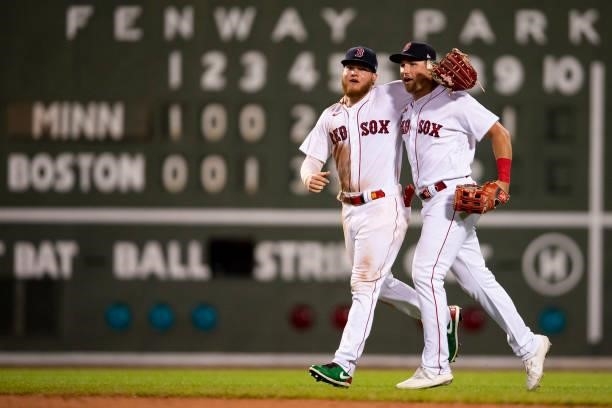 Alex Verdugo and Hunter Renfroe of the Boston Red Sox celebrate a victory against the Minnesota Twins on August 24, 2021 at Fenway Park in Boston,...