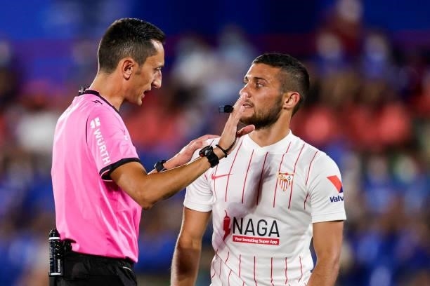 Referee Jose Maria Sanchez Martinez, Oscar Rodriguez of Sevilla FC during the La Liga Santander match between Getafe v Sevilla at the Coliseum...