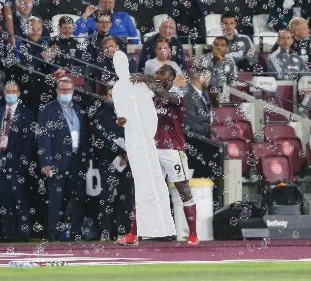 West Ham United's Michail Antonio celebrates scoring his side's third goal by lifting a cardboard cut out of himself during the Premier League match...