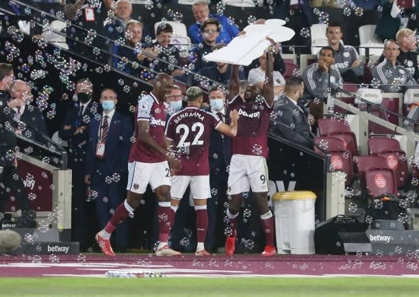 West Ham United's Michail Antonio celebrates scoring his side's third goal by lifting a cardboard cut out of himself during the Premier League match...