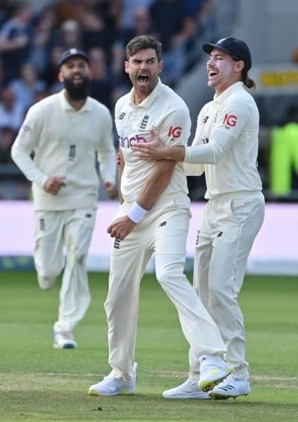 England's James Anderson celebrates taking the wicket of India's captain Virat Kohli with England's Rory Burns on the first day of the third cricket...