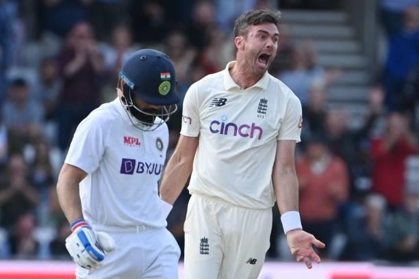 England's James Anderson celebrates taking the wicket of India's captain Virat Kohli on the first day of the third cricket Test match between England...