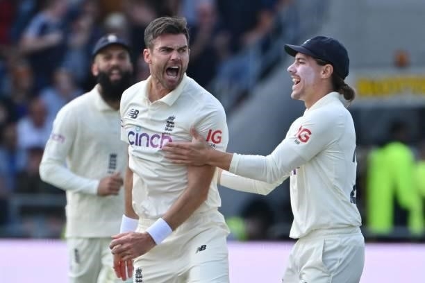 England's James Anderson celebrates taking the wicket of India's captain Virat Kohli with England's Rory Burns on the first day of the third cricket...