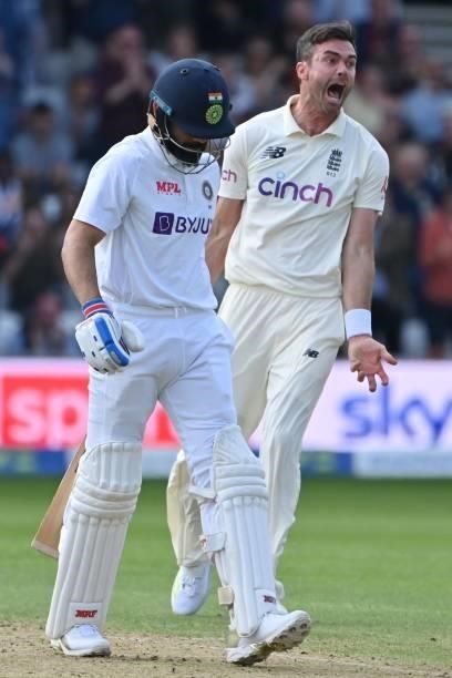 England's James Anderson celebrates taking the wicket of India's captain Virat Kohli on the first day of the third cricket Test match between England...