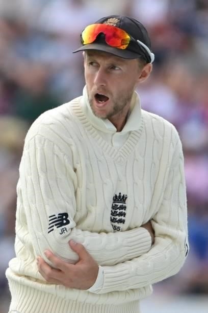 England's captain Joe Root reacts after hurting his finger on the first day of the third cricket Test match between England and India at Headingley...