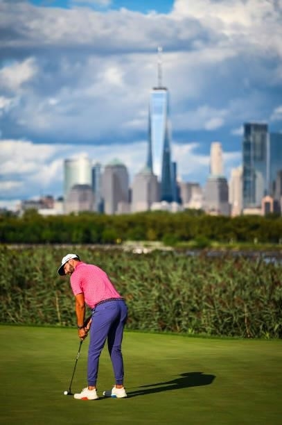 Erik van Rooyen of South Africa putts on the 14th hole green with a view of the New York City skyline during the final round of THE NORTHERN TRUST,...