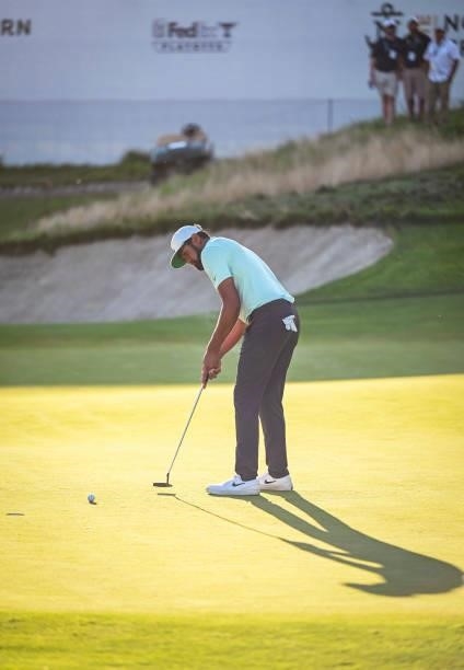 Tony Finau makes a par putt on the 18th hole green during the final round of THE NORTHERN TRUST, the first event of the FedExCup Playoffs, at Liberty...