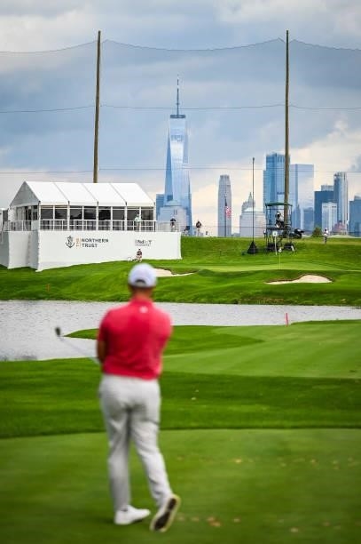 Jon Rahm of Spain watches his shot on the fourth hole facing the New York City skyline during the final round of THE NORTHERN TRUST, the first event...