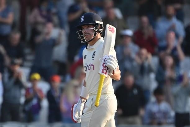 England's Rory Burns celebrates his half-century on the first day of the third cricket Test match between England and India at Headingley cricket...