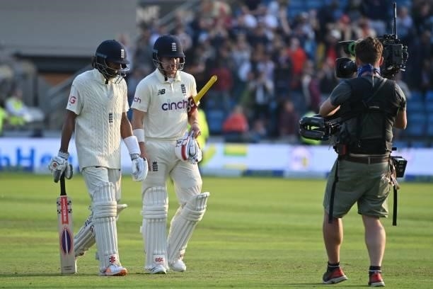 England's Haseeb Hameed and England's Rory Burns walk off at stumps on the first day of the third cricket Test match between England and India at...