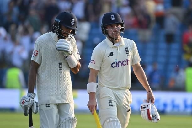 England's Haseeb Hameed and England's Rory Burns walk off at stumps on the first day of the third cricket Test match between England and India at...