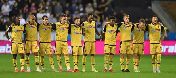 The Bolton players during the penalty shoot out during the Carabao Cup Second Round match between Wigan Athletic and Bolton Wanderers at DW Stadium...