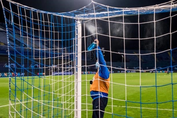 Stadium worker desinfects the goal before the UEFA Champions League Play-Offs Leg Two match between Dinamo Zagreb and FC Sheriff at Maksimir Stadium...