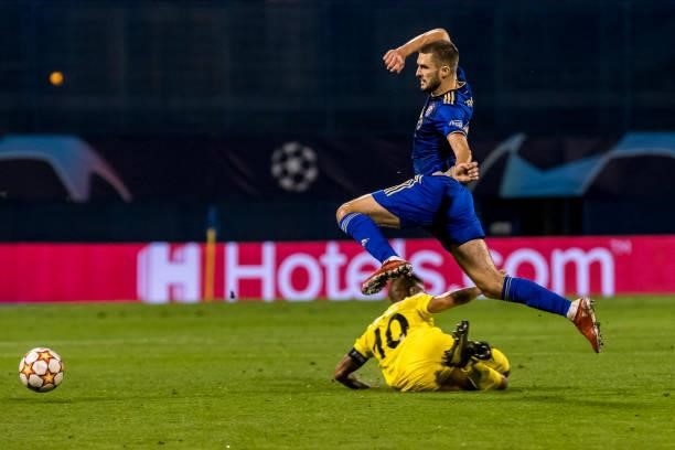 Bartol Franjic of Dinamo Zagreb dribbles the ball past Frank Castaneda of FC Sheriff during the UEFA Champions League Play-Offs Leg Two match between...