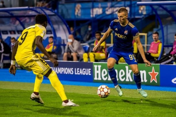Mislav Orsic of Dinamo Zagreb dribbles the ball past Adama Traore of FC Sheriff during the UEFA Champions League Play-Offs Leg Two match between...