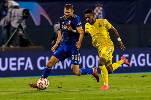Momo Yansane of FC Sheriff fights for the ball with Bartol Franjic of Dinamo Zagreb defence during the UEFA Champions League Play-Offs Leg Two match...