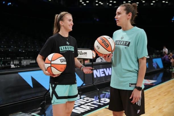 Sabrina Ionescu and Assistant Coach, Jacki Gemelos of the New York Liberty talk before the game against the Phoenix Mercury on August 25, 2021 at...