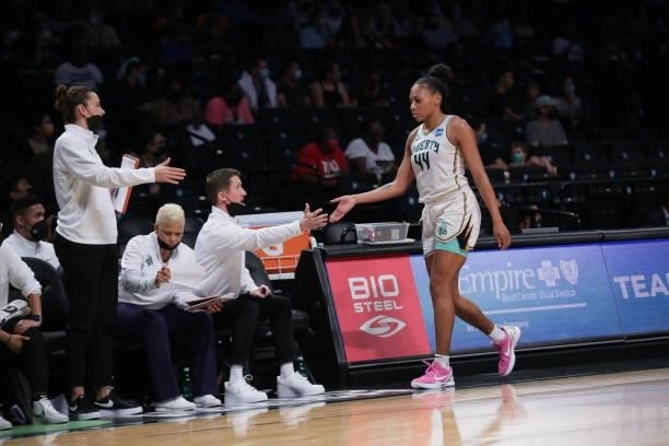 Betnijah Laney of the New York Liberty high fives her coaches during the game against the Phoenix Mercury on August 25, 2021 at Barclays Center in...