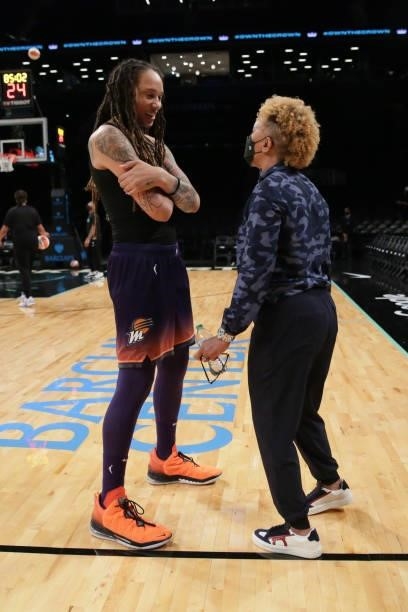 Brittney Griner of the Phoenix Mercury talks with NBA legend, Teresa Weatherspoon before the game against the New York Liberty on August 25, 2021 at...
