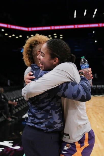 Kia Nurse of the Phoenix Mercury hugs NBA legend, Teresa Weatherspoon before the game against the New York Liberty on August 25, 2021 at Barclays...