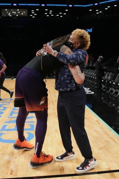 Legend, Teresa Weatherspoon hugs Brittney Griner of the Phoenix Mercury before the game against the New York Liberty on August 25, 2021 at Barclays...