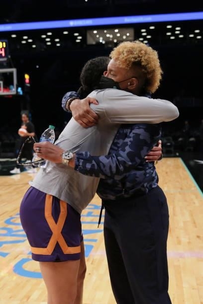 Legend, Teresa Weatherspoon hugs Kia Nurse of the Phoenix Mercury before the game against the New York Liberty on August 25, 2021 at Barclays Center...