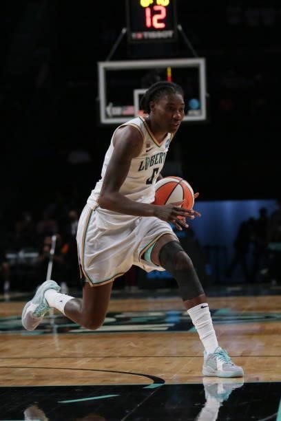 Natasha Howard of the New York Liberty drives to the basket against the Phoenix Mercury on August 25, 2021 at Barclays Center in Brooklyn, New York....
