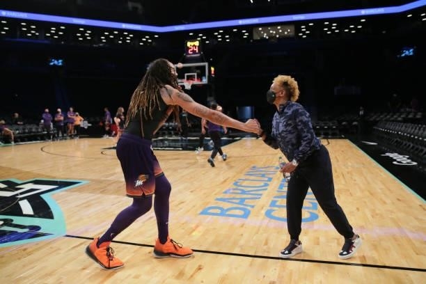 Brittney Griner of the Phoenix Mercury shakes hands with NBA legend, Teresa Weatherspoon before the game against the New York Liberty on August 25,...
