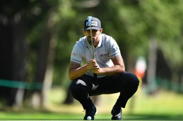 Matthieu Pavon of France putting at the 6th hole during Day One of The Omega European Masters at Crans-sur-Sierre Golf Club on August 26, 2021 in...