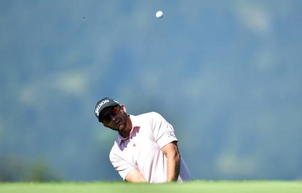 Dean Burmester of Republic of South Africa plays his third shot to the 7th hole during Day One of The Omega European Masters at Crans-sur-Sierre Golf...