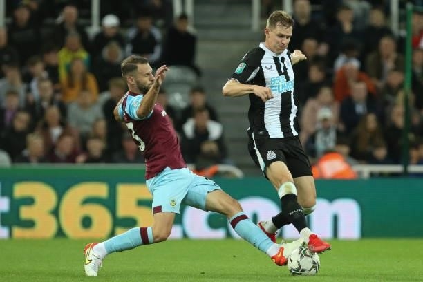 Emil Krafth of Newcastle United and Erik Pieters of Burnley in action during the Carabao Cup match between Newcastle United and Burnley at St....