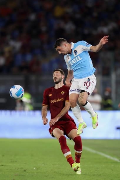 Matias Vina of AS Roma competes for the ball with Abdulkadir Parmak of Trabzonspor during the UEFA Conference League Play-Offs Leg Two match between...