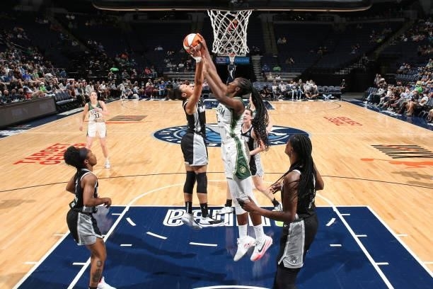 Aerial Powers of the Minnesota Lynx and Ezi Magbegor of the Seattle Storm leap for the ball on August 24, 2021 at Target Center in Minneapolis,...