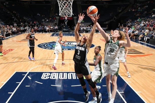 Breanna Stewart of the Seattle Storm and Aerial Powers of the Minnesota Lynx leap for the ball on August 24, 2021 at Target Center in Minneapolis,...
