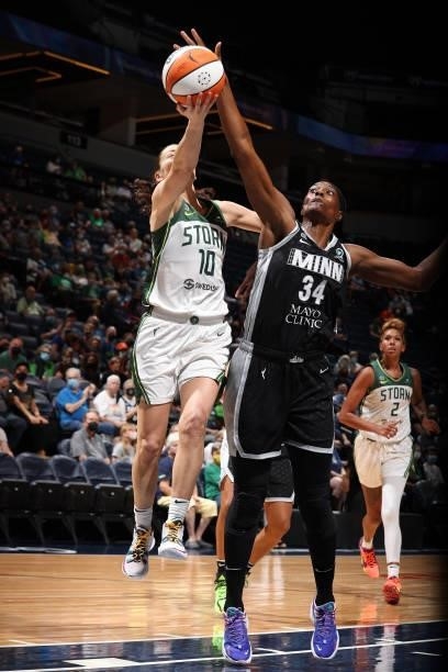 Sylvia Fowles of the Minnesota Lynx plays defense on Sue Bird of the Seattle Storm on August 24, 2021 at Target Center in Minneapolis, Minnesota....