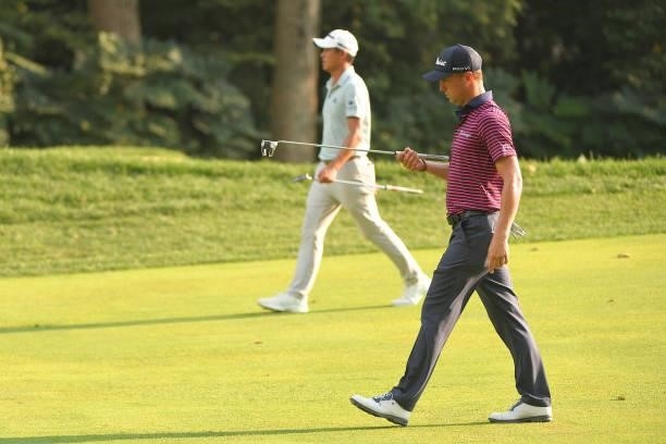 Justin Thomas and Collin Morikawa walk along the 15th fairway during the first round of the BMW Championship at Caves Valley Golf Club on August 26,...
